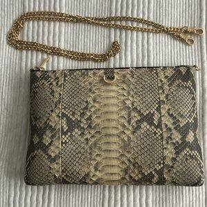 Snake print textured clutch with gold hardware and strap